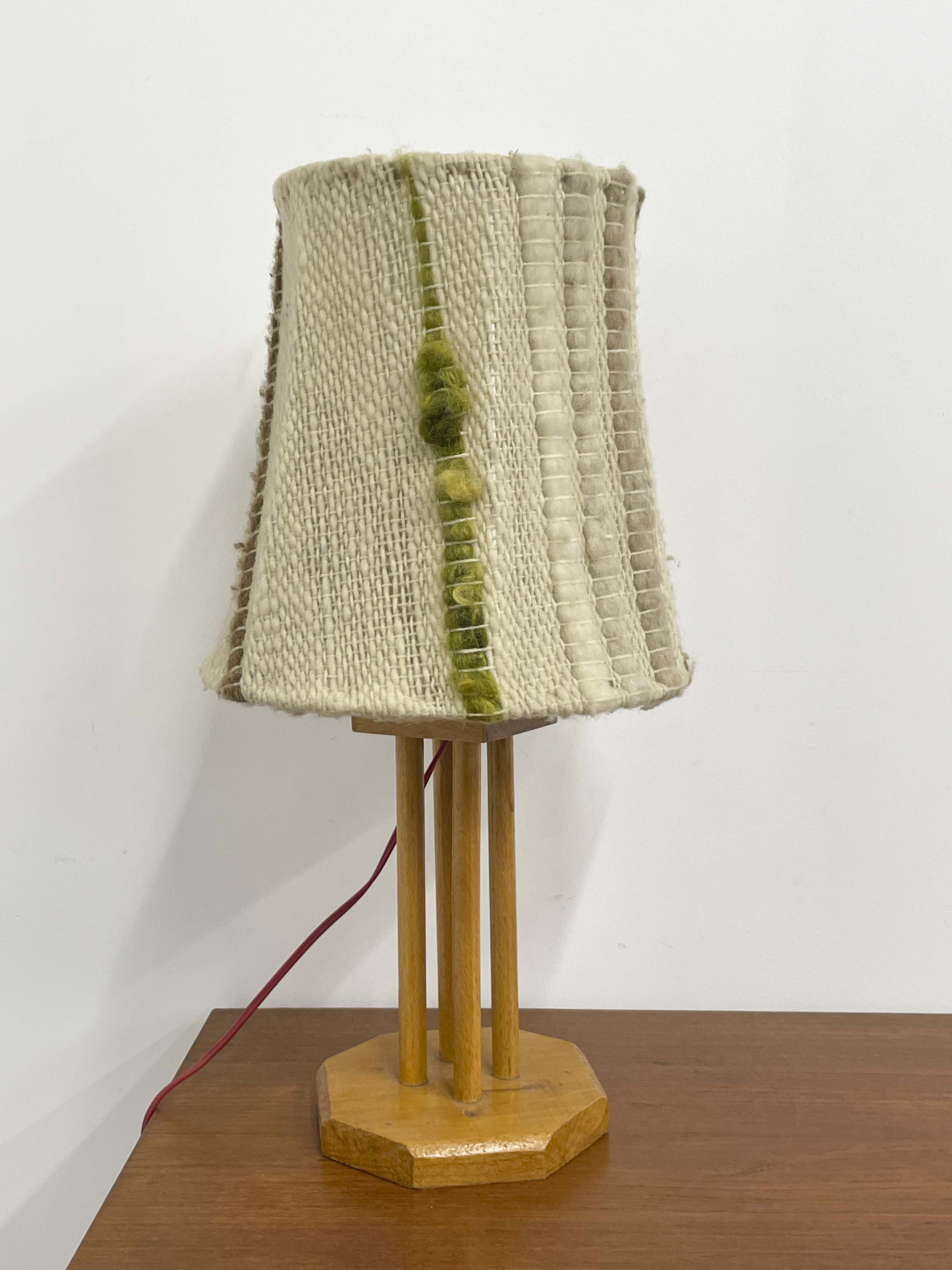Wooden lamp with a wool shade