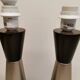 Two table lamps made of dark-stained wood with silver detail in the middle.