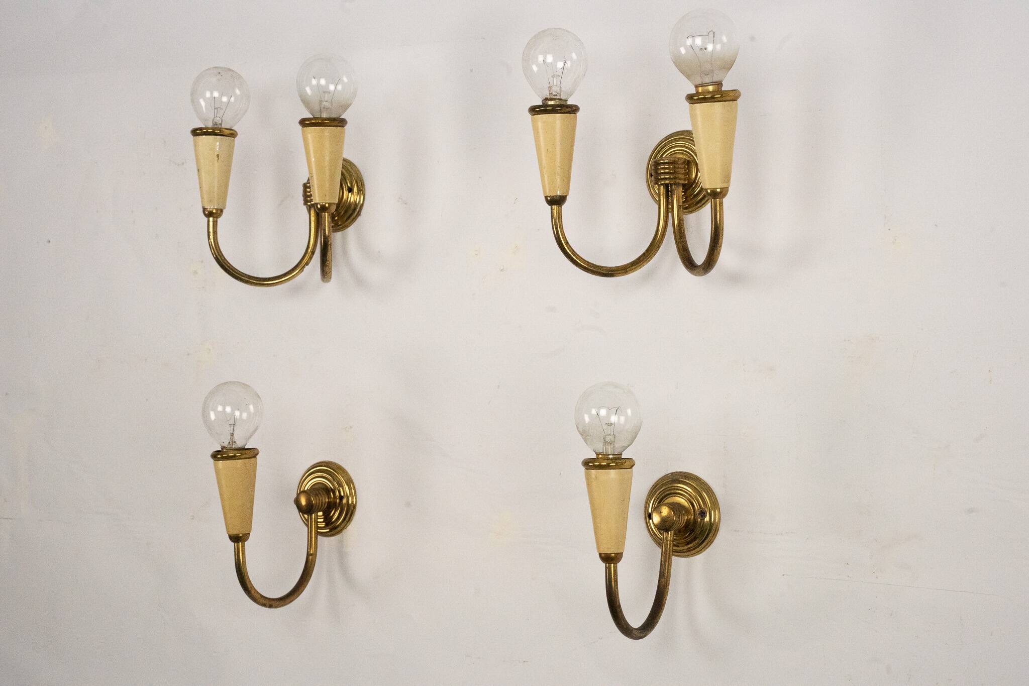 Set of four Mid-Century sconces in lacquer and brass. Italy 1950s