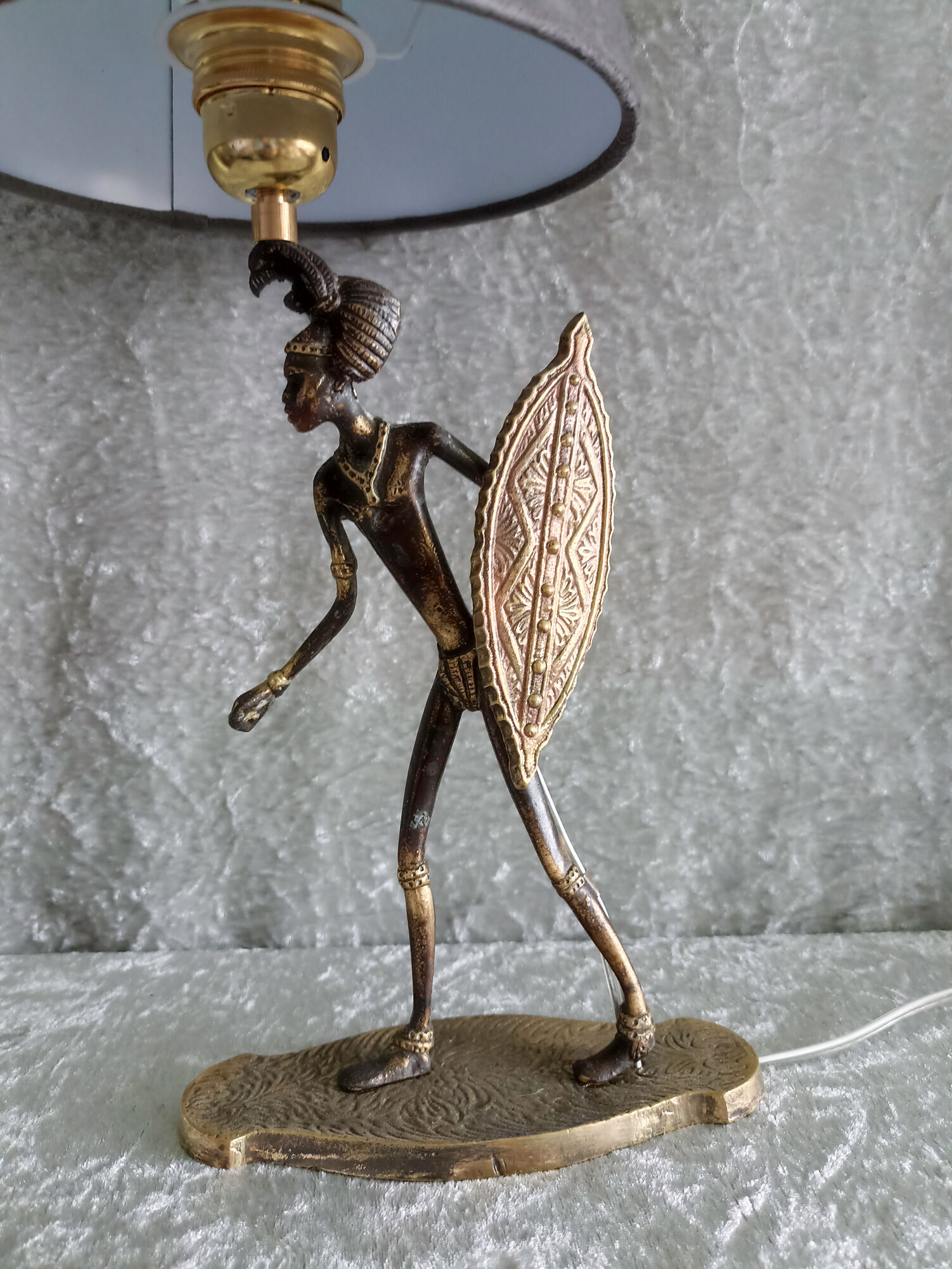 African warrior lamp in bronze.