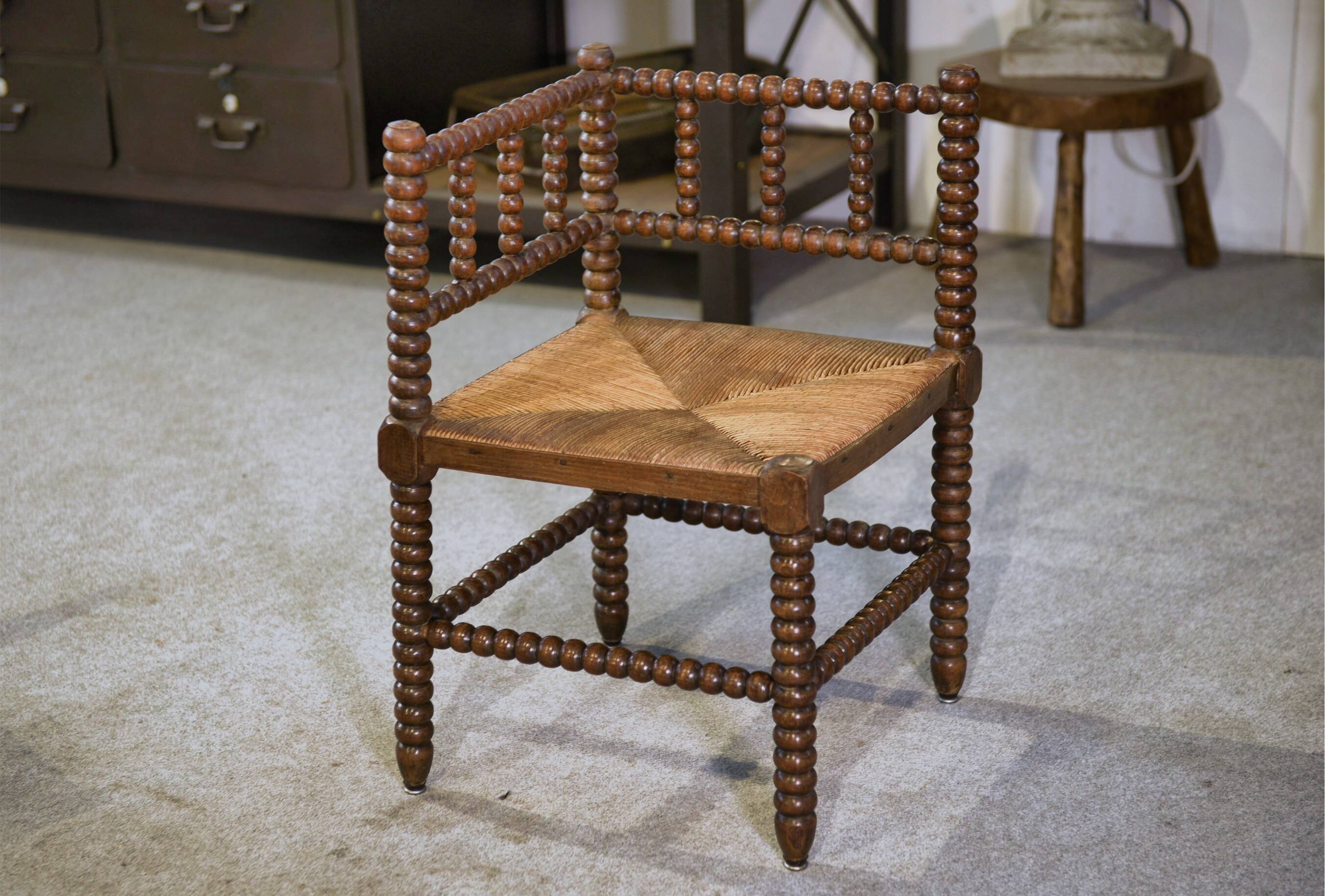 Pair of turned wooden corner chairs from the 1950s.