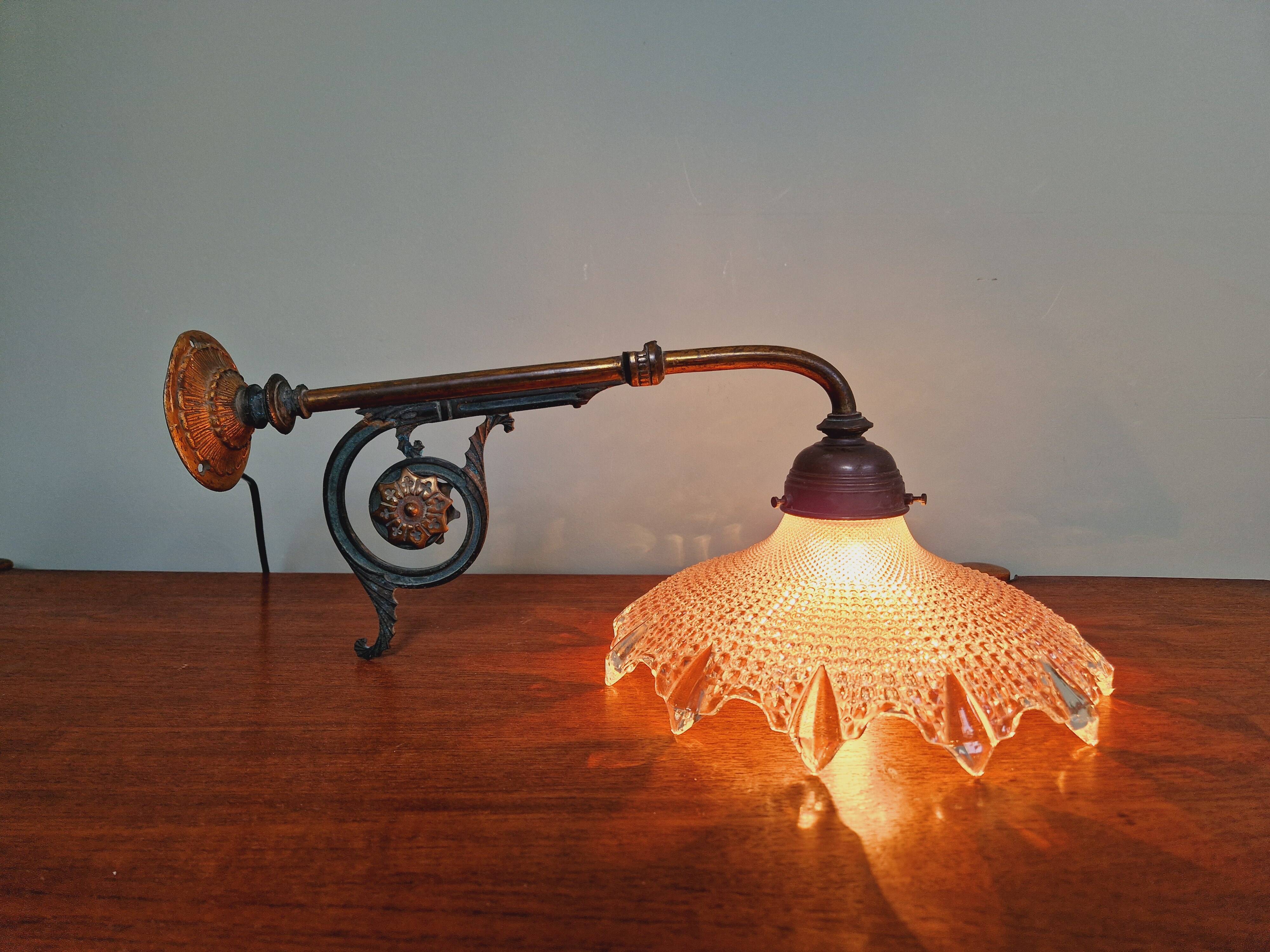 Pair of pendant lights in bronze and scalloped transparent glass