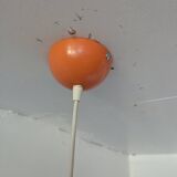 Pair of 70's globes in orange lacquered metal.