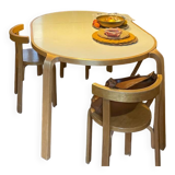 Attractive designer set: table, chairs and stool