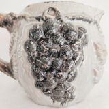 Pitcher bunches of grapes in relief
