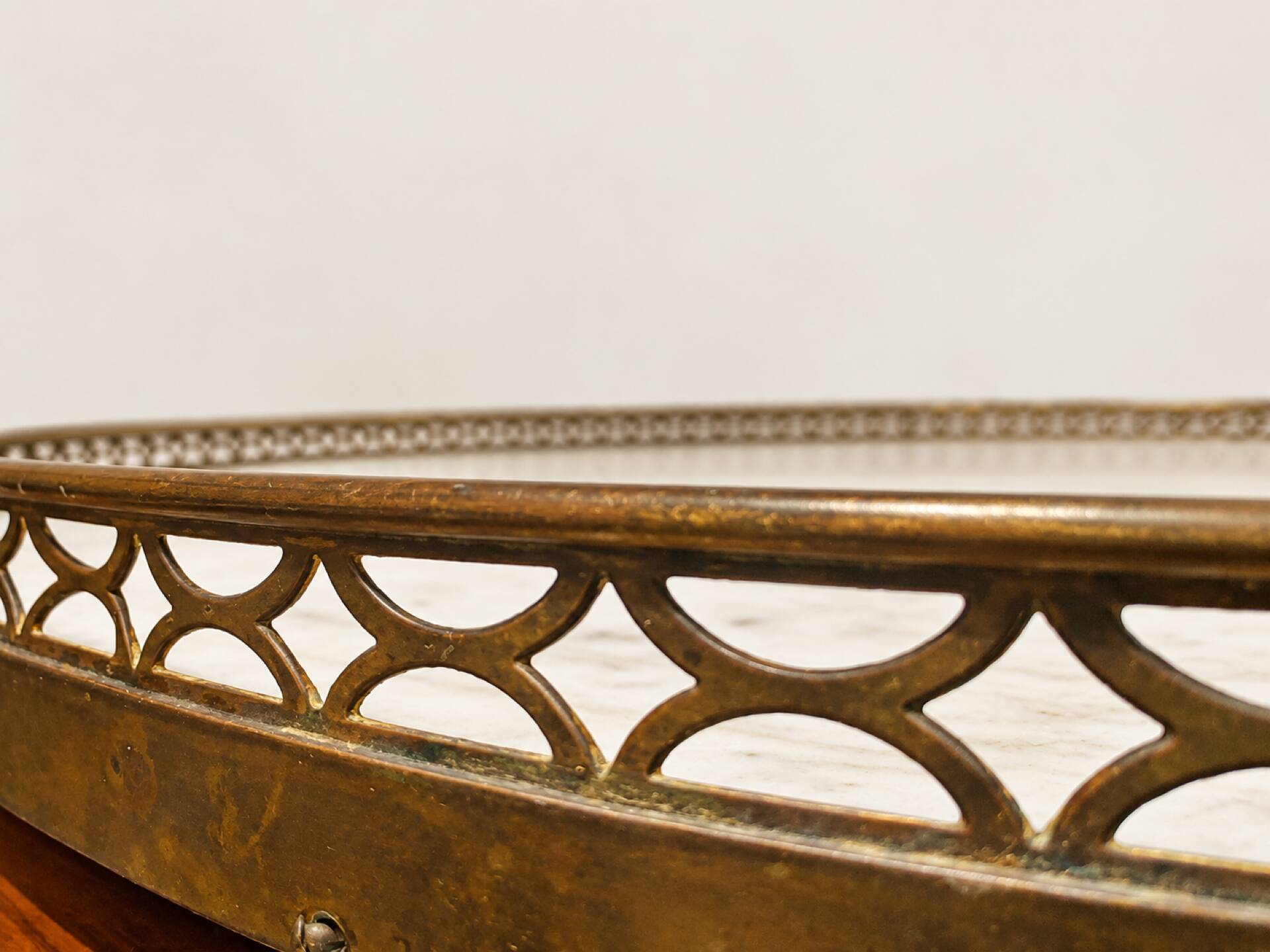 Bouillotte table in Louis XVI style with marquetry, marble, and brass.