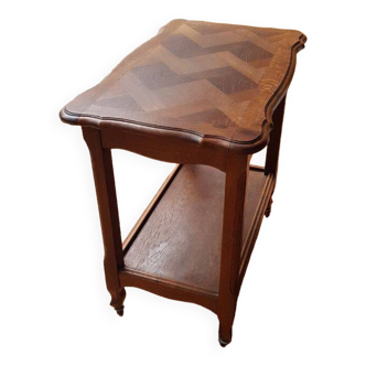 Wooden side table on casters