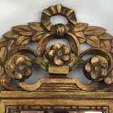 Vintage pediment mirror in gilded wood, XXth