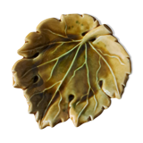 Empty yellow ceramic pocket in the shape of a leaf