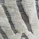 Large hand-knotted beige and cream Berber rug, 2.90m x 1.80m.