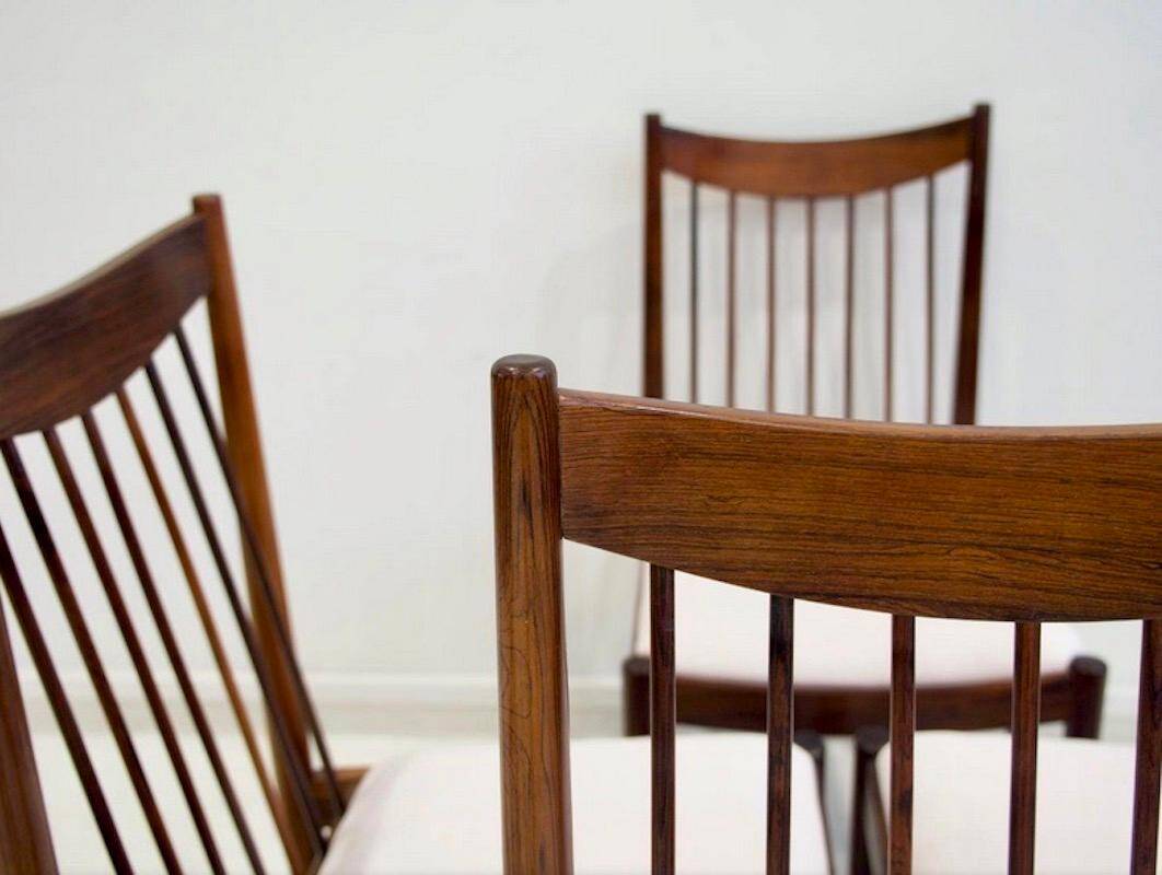 Set of six wooden dining chairs Arne Vodder Model No 422 with fabric upholstery.