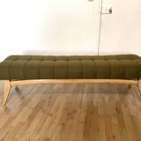 Wooden bench and green fabric