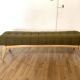 Wooden bench and green fabric