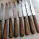 Old table knives and dessert knives, wooden handles, stainless steel blades