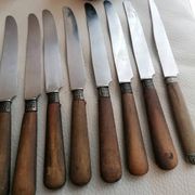 Old table knives and dessert knives, wooden handles, stainless steel blades