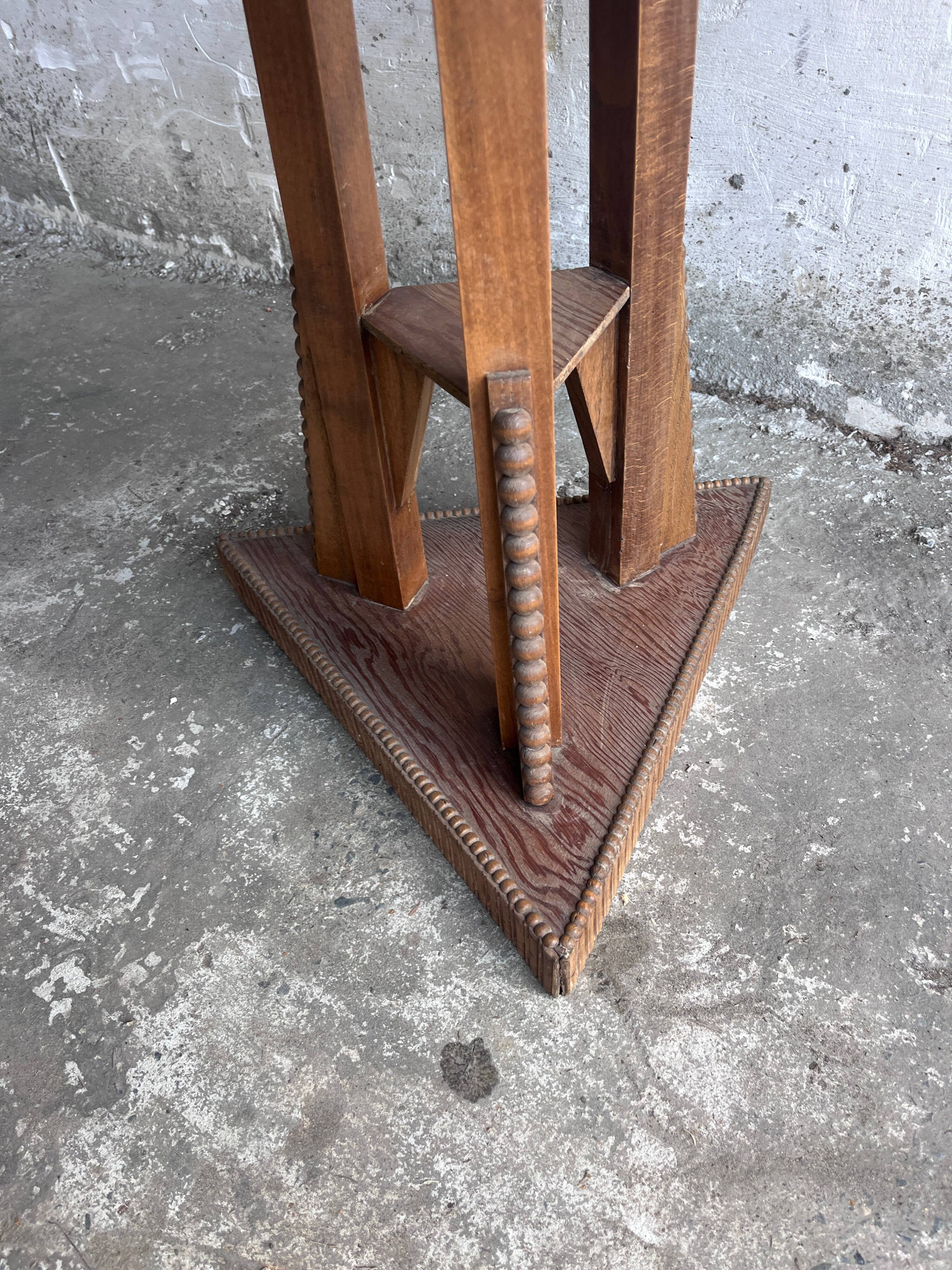 Triangular side table in carved wood, Art Nouveau, France, circa 1915.