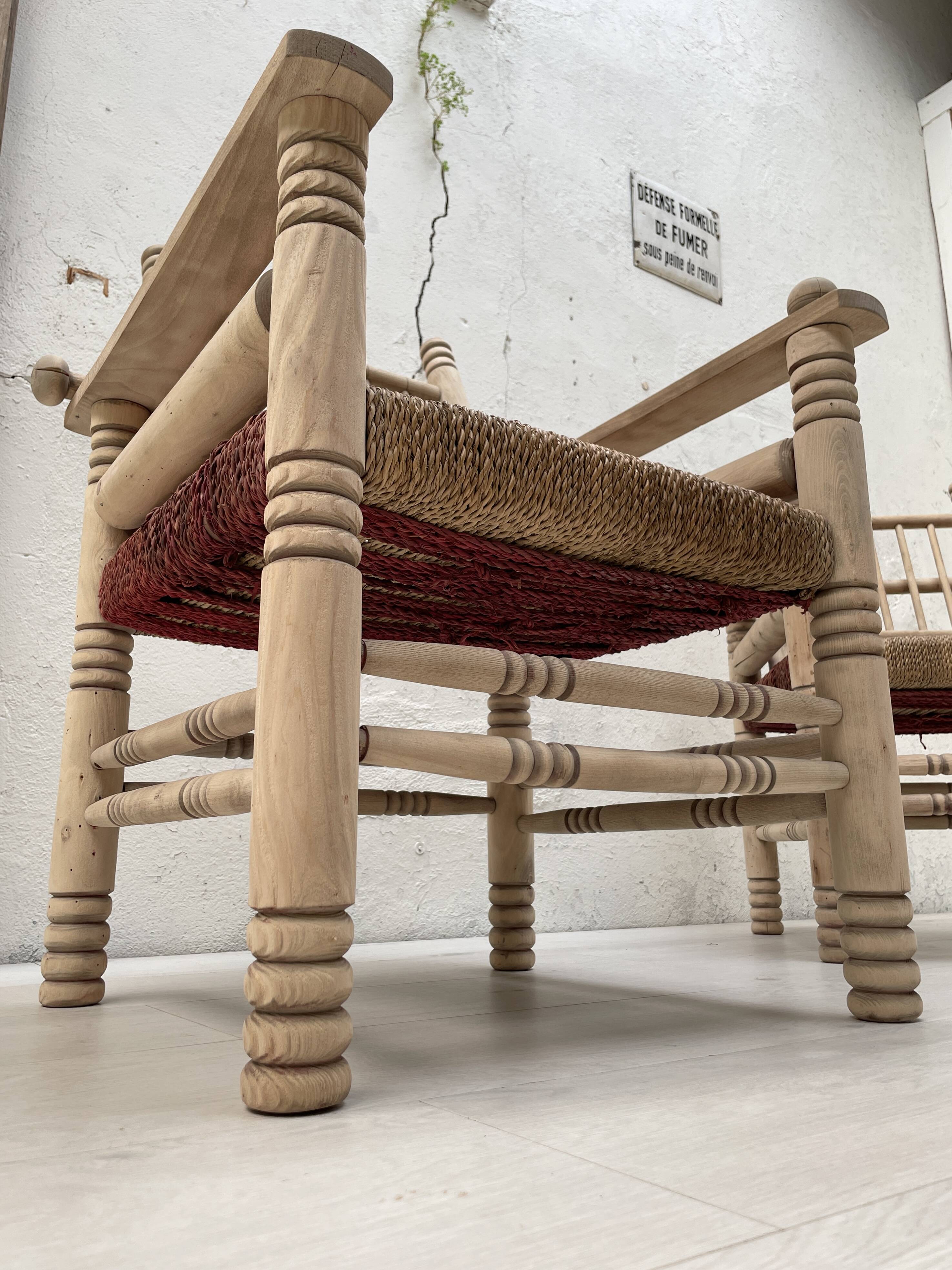 Pair of wooden armchairs and ropes