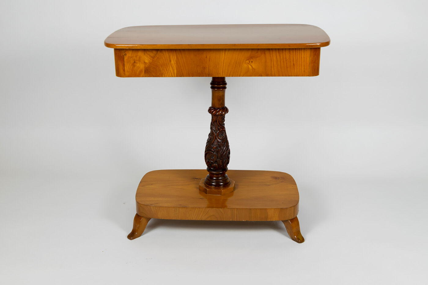 Danish Biedermeier elm occasional table with carved base and drawer