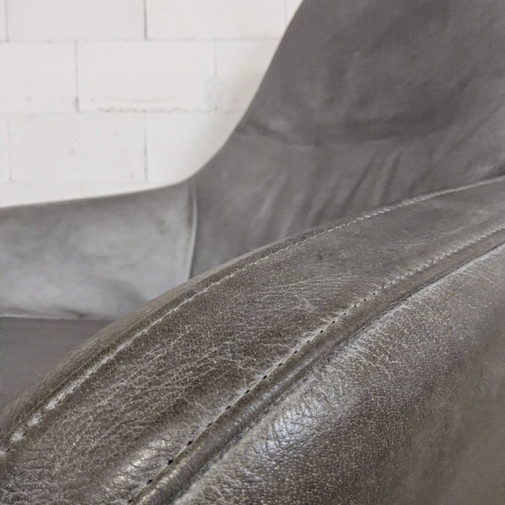 Grey leather swivel armchair Specter by DYYK (Almost new)