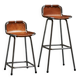 Set of 2 stools "Les Arcs" selected by Charlotte Perriand in leather.