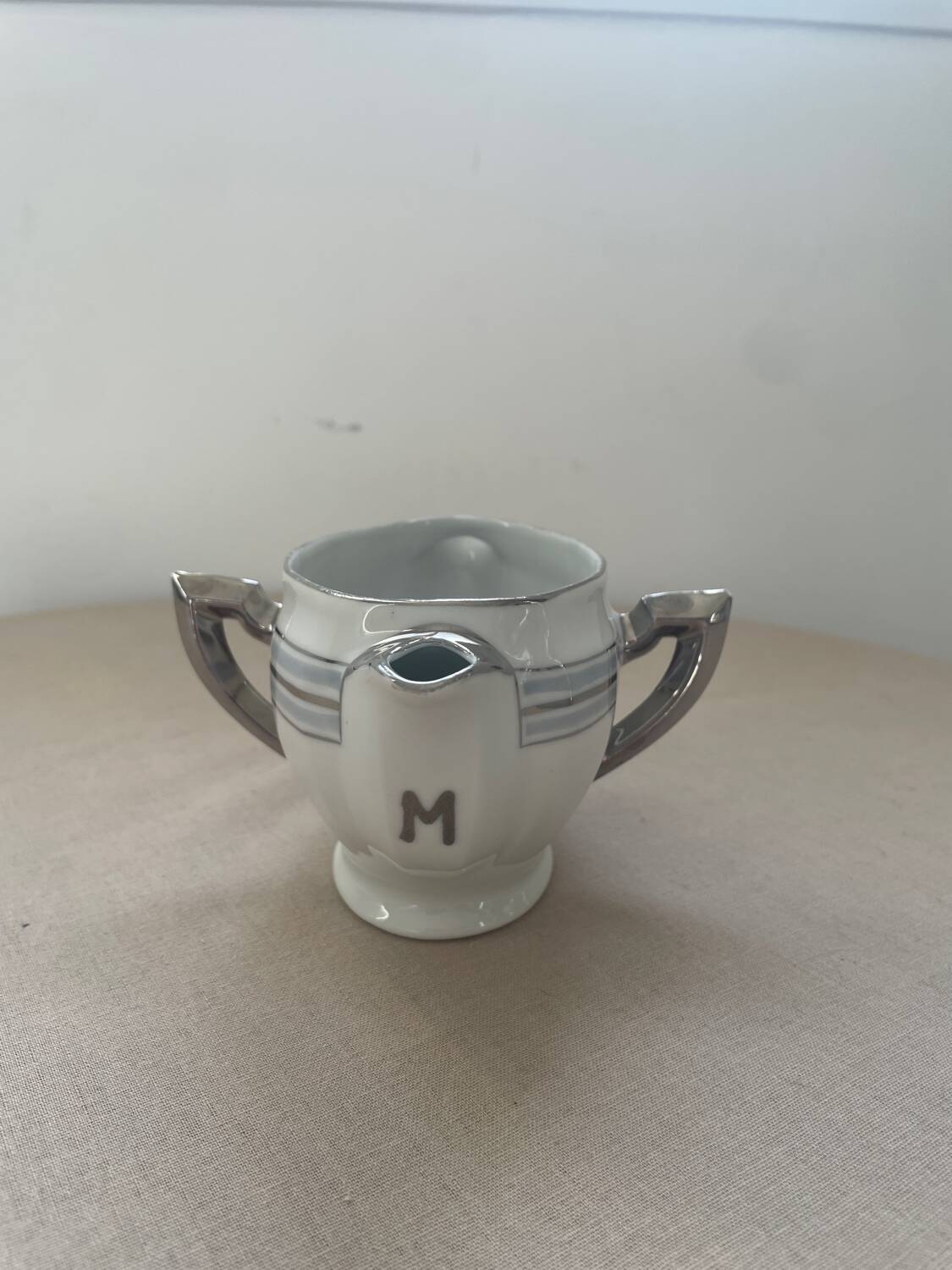 Antique white French porcelain sauce boat M&S with silver trim.