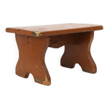 French rustic low church stool in terracotta painted wood, ca. 1900