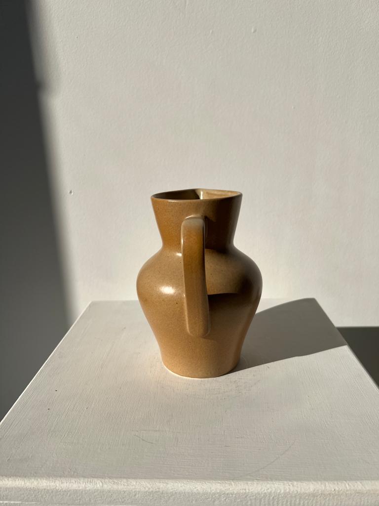 Small pitcher in light beige sandstone