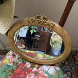 Oval mirror in gilded wood with knot, 32x37 cm