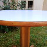 Round table in white formica and wood