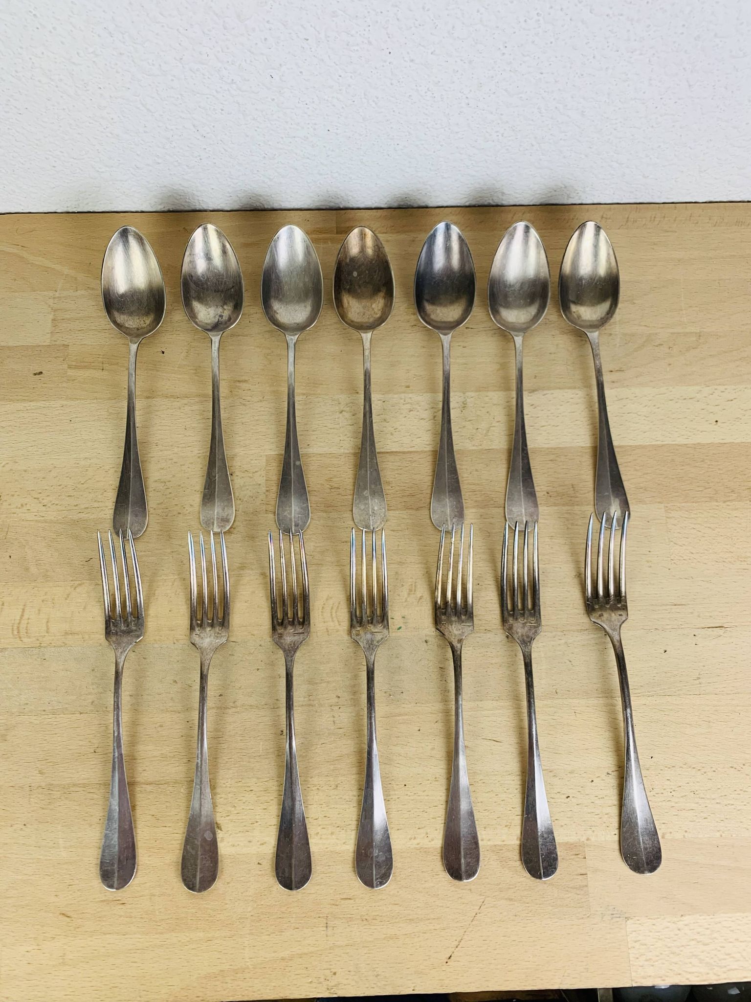 7 vintage silver plated forks and 7 spoons
