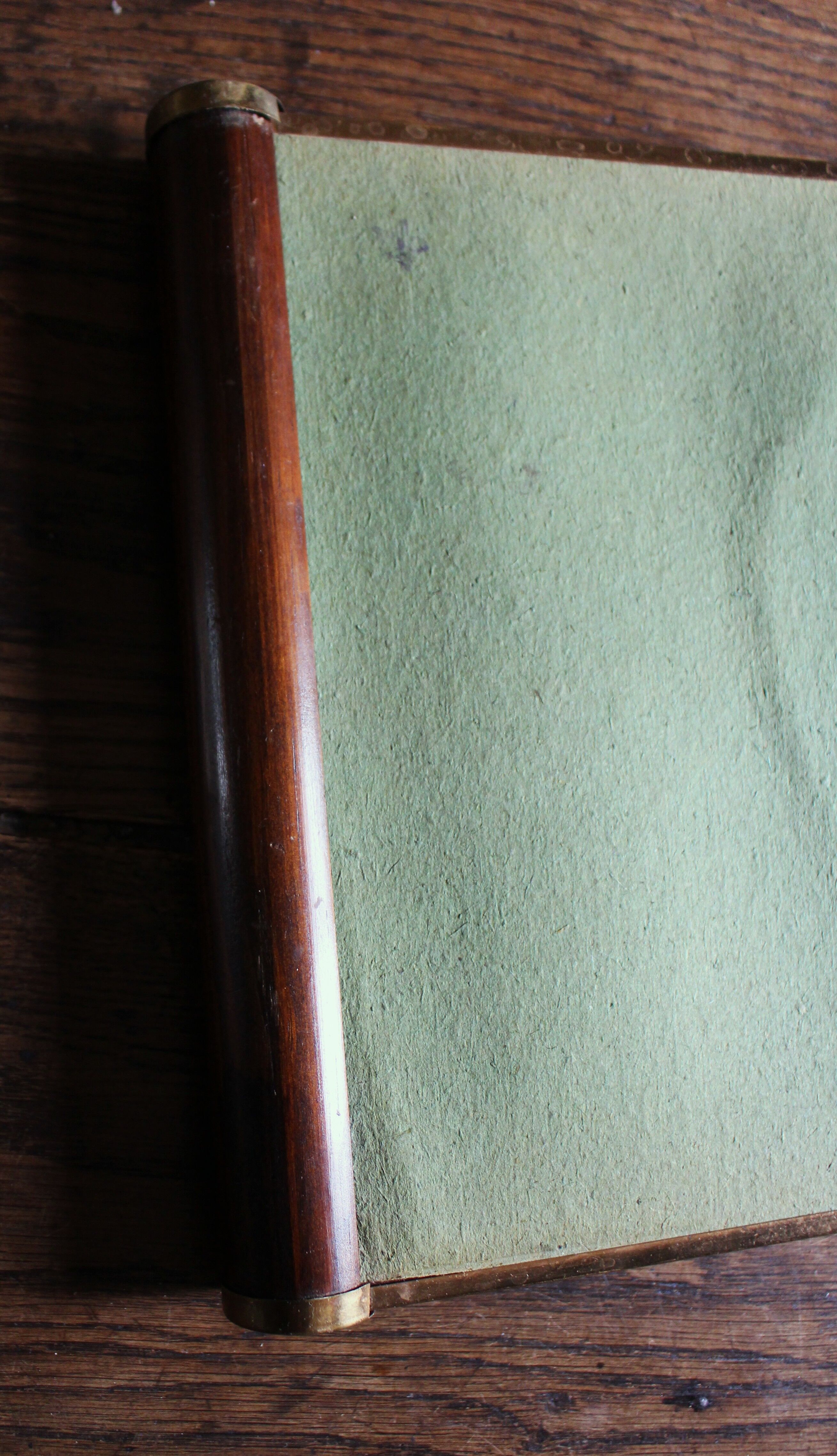 Rectangular mirror tray with wooden handles and gilding.