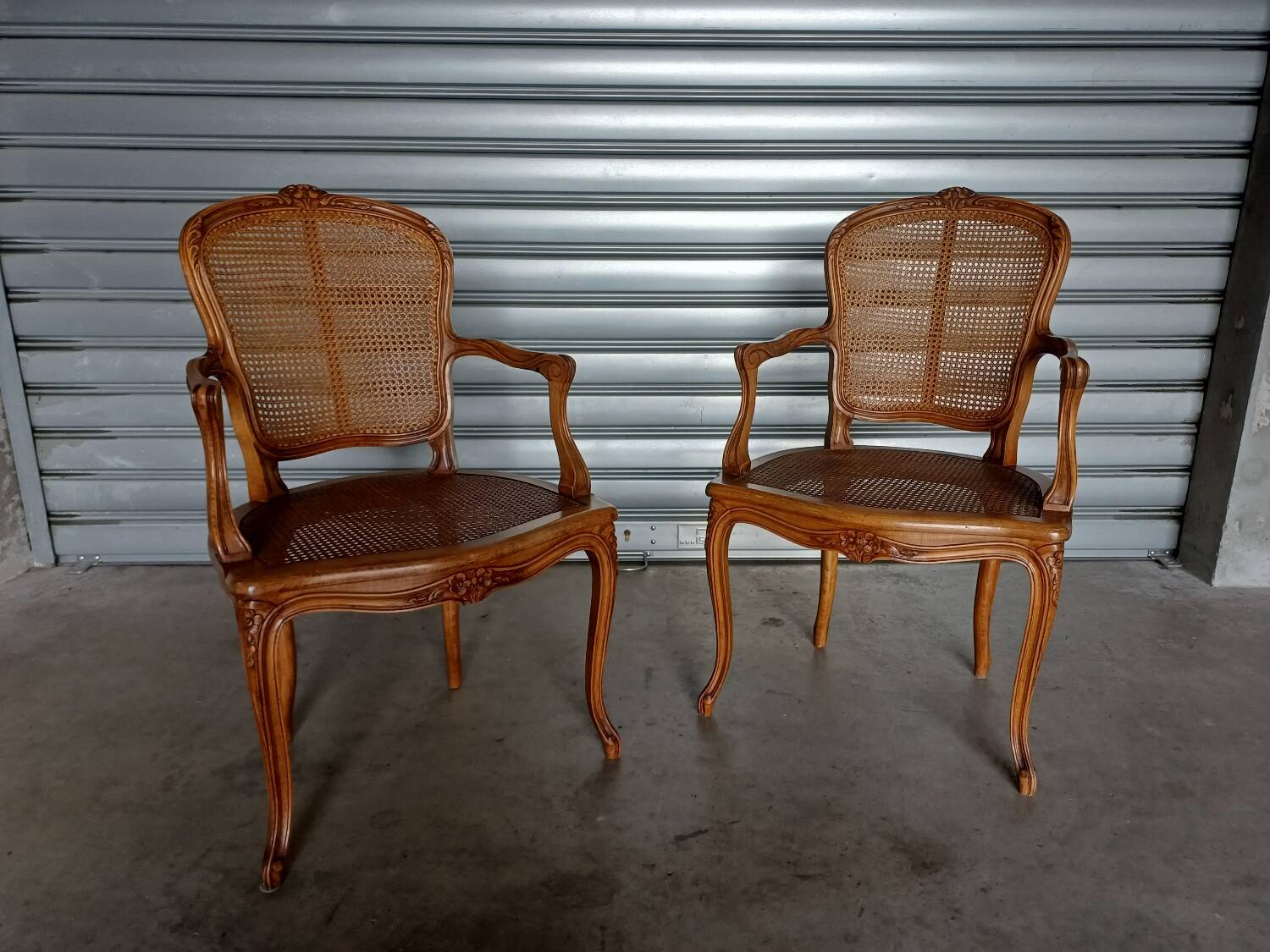 Pair of caned cabriolet armchairs
