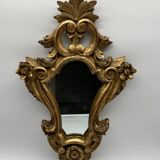Wooden mirror with gilded stucco