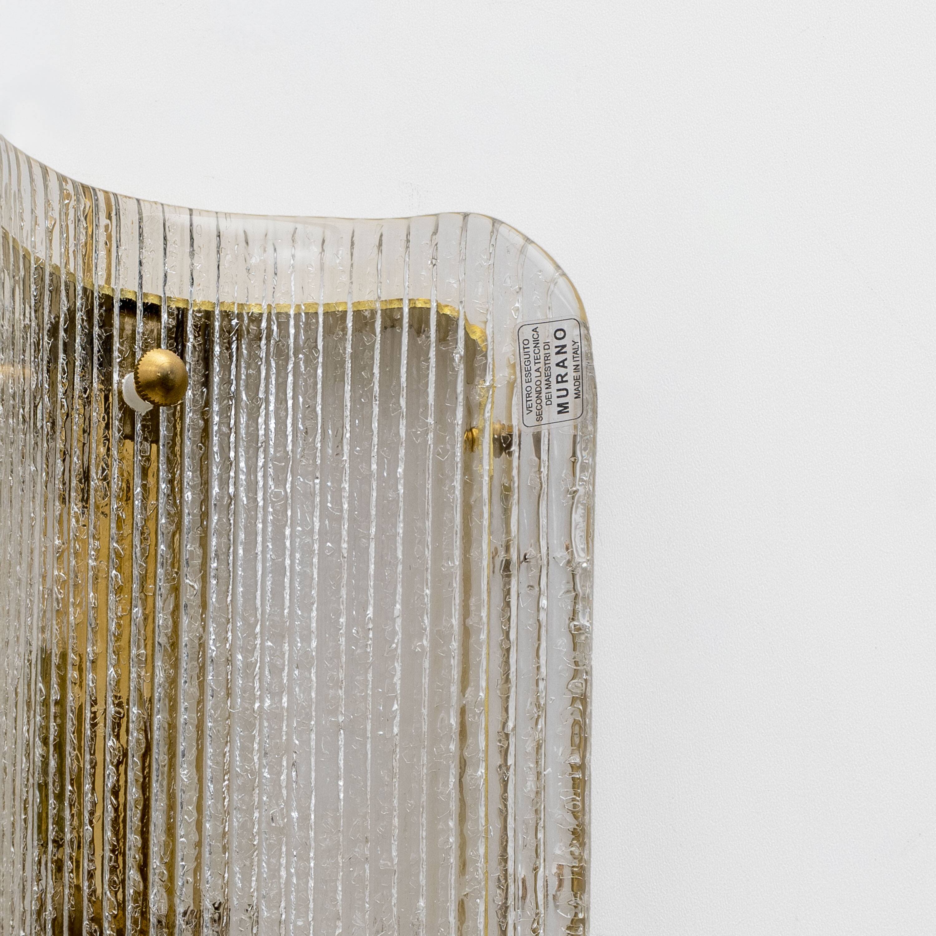 Pair of Curved Clear Ribbed Murano Glass and Brass Wall Sconces
