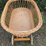 Vintage wicker cradle on casters