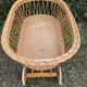 Vintage wicker cradle on casters