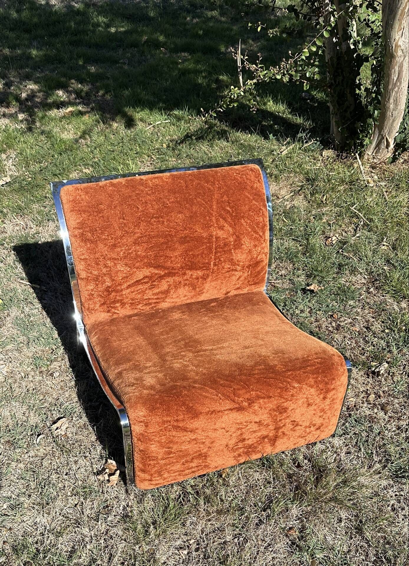 Chrome steel armchair and orange fabric by Vittorio Introini