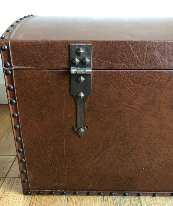 Ancient wooden and faux leather trunk