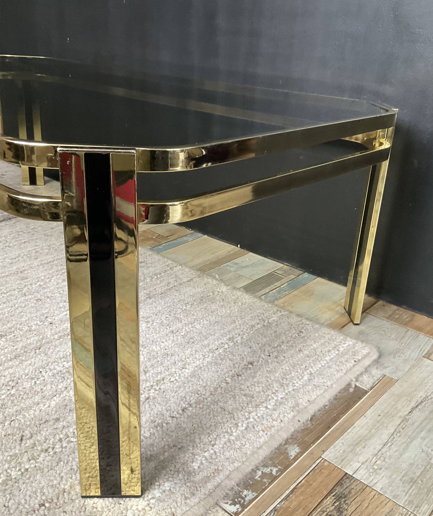 Vintage 1970s coffee table in gold metal and smoked glass.