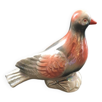 Antique bird in pearly ceramic