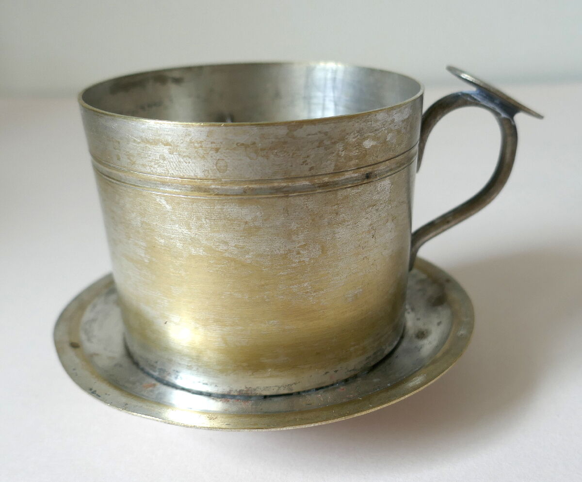 Individual silver metal coffee maker