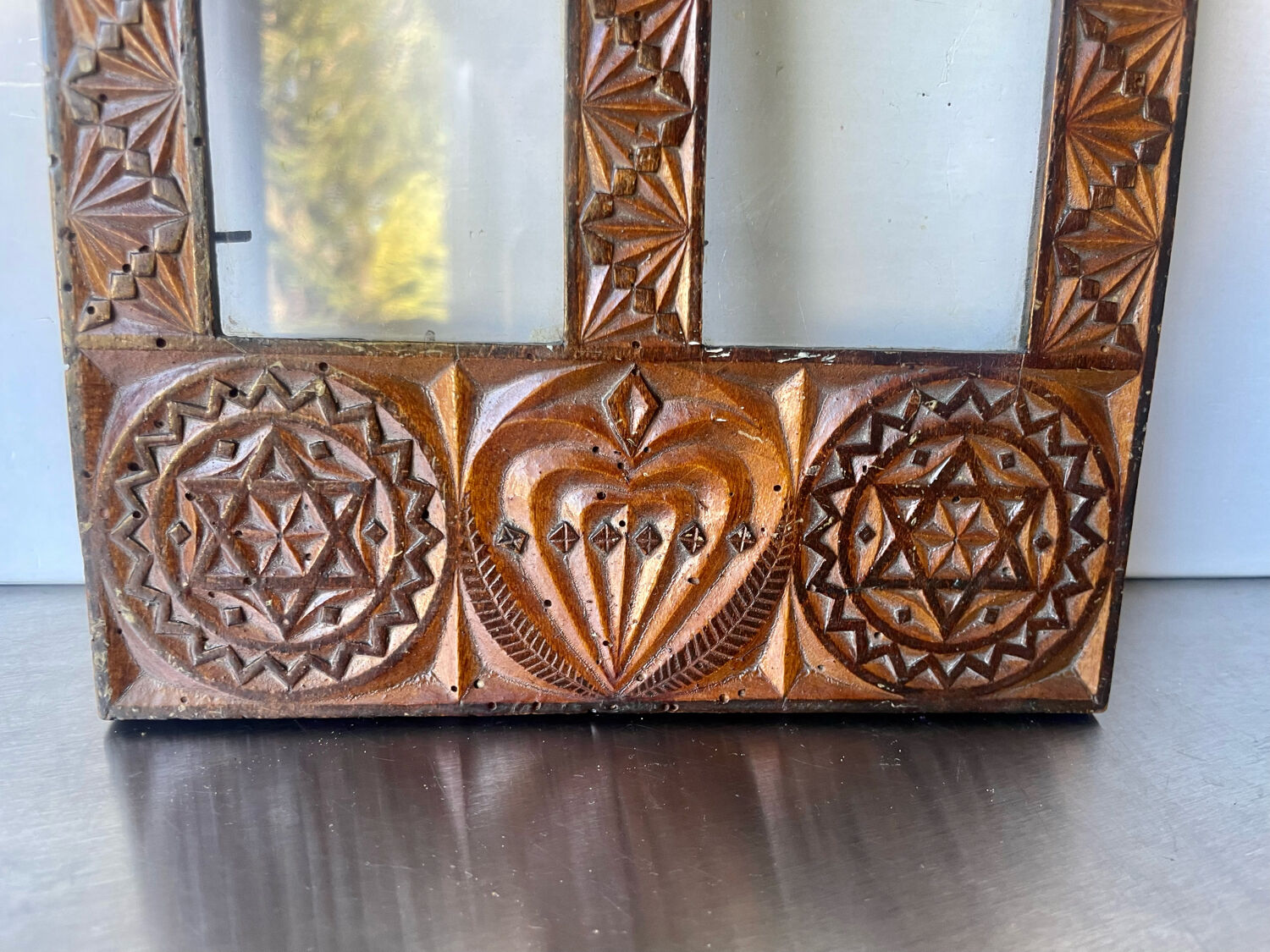 Double frame intricately carved wood