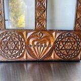 Double frame intricately carved wood