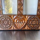 Double frame intricately carved wood