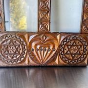 Double frame intricately carved wood