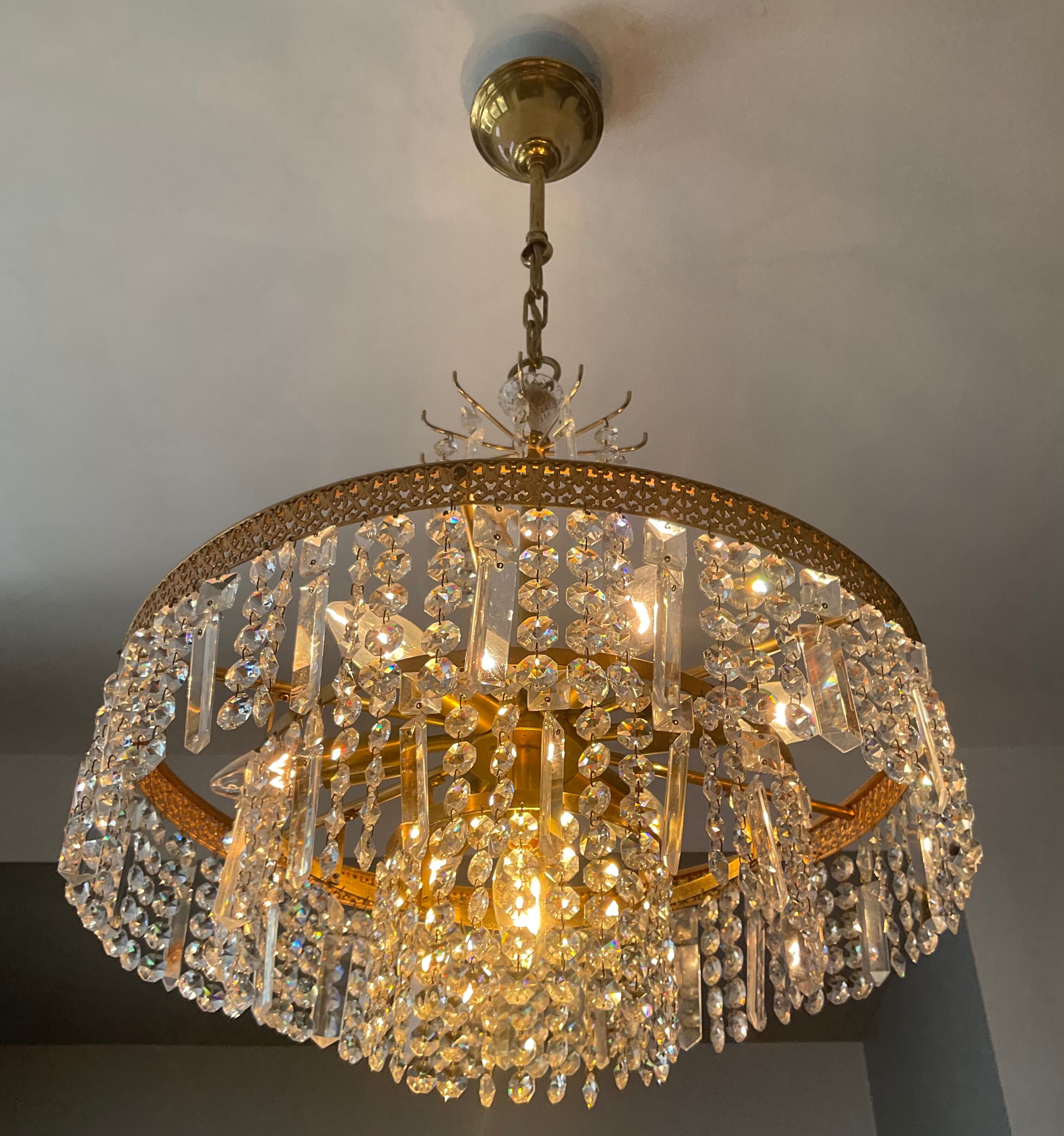 Old brass chandelier and crystal grapevines