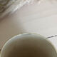 Vintage 70s old ceramic mug with a brown cubic graphic pattern.