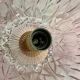Antique pink glass pendant light with tassels.