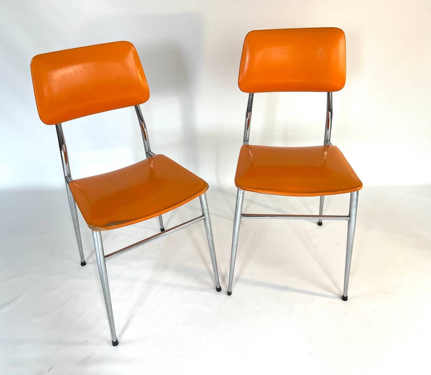 Pair of vintage orange leatherette chairs