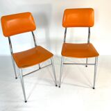 Pair of vintage orange leatherette chairs